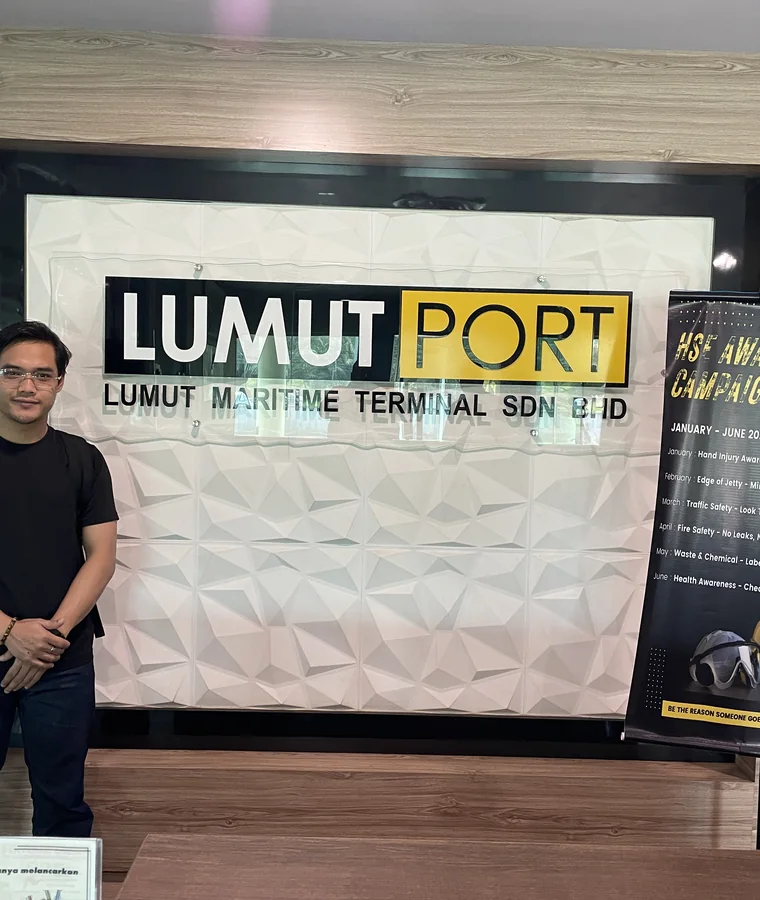 Lumut Maritime Terminal reception beside its HSE awareness campaign board