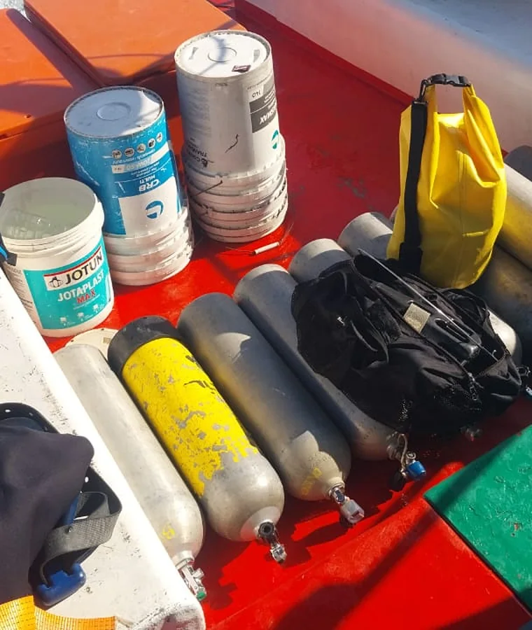 Dive cylinders, coatings and tooling laid out ready for the operation