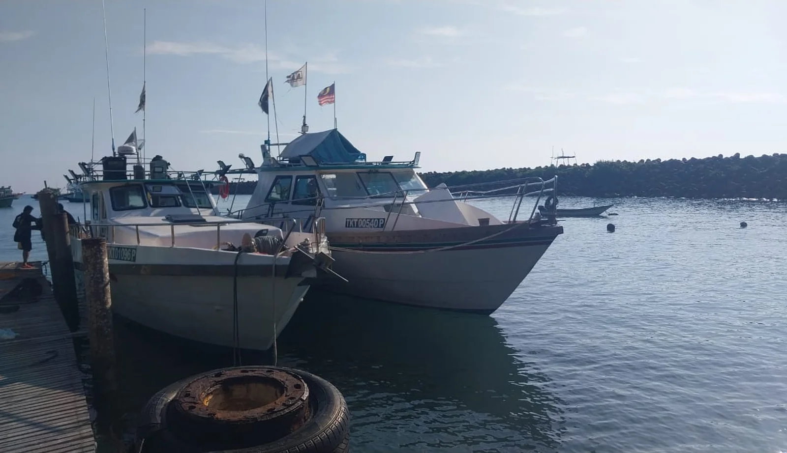 Work boats moored alongside the jetty