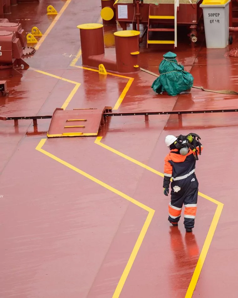 Deck officer walking a marked tanker deck