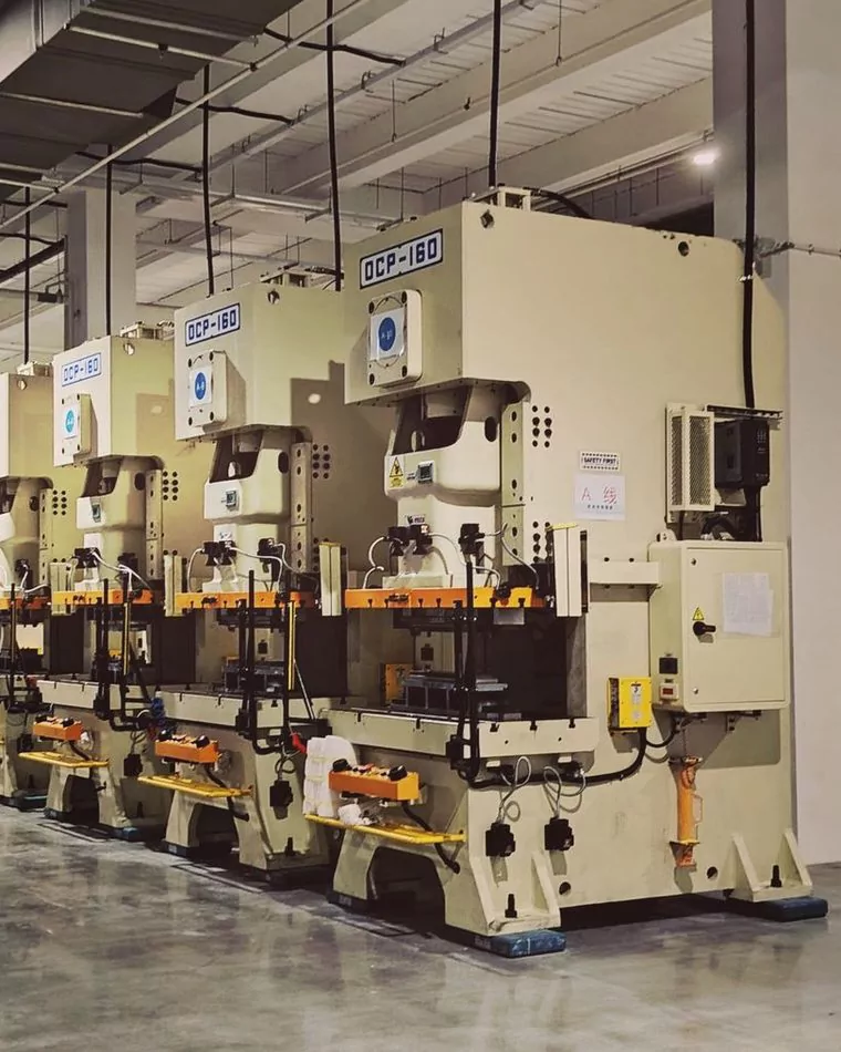 Row of industrial machinery on a plant floor