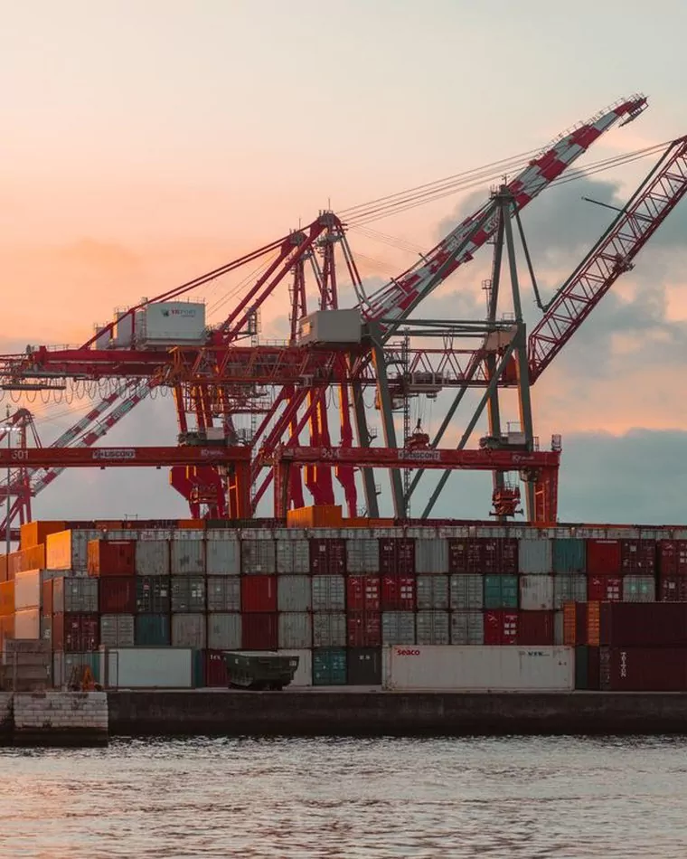 Container cranes at a port terminal at dusk